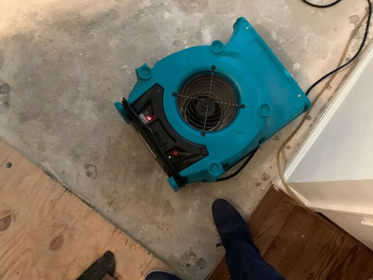 Air mover drying subfloor during Leak Detection & Repair in Covina